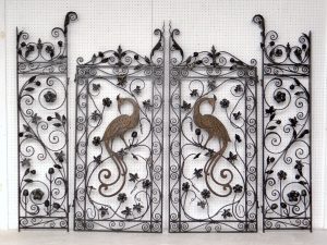 Pair iron and bronze gates with Bird of Paradise